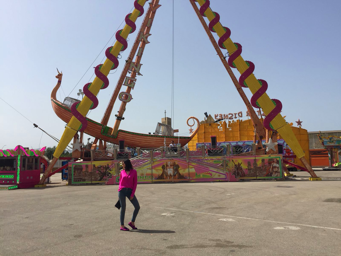 Style Indigo wearing a pink dress as a shirt in a amusement park